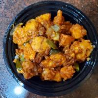 Paneer Manchurian · Batter fried Paneer sauteed with peppers and Manchurian Sauce.