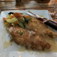 Chicken Francese · Battered chicken breast braised in lemon, butter and chardonnay white wine with fresh sauce.
