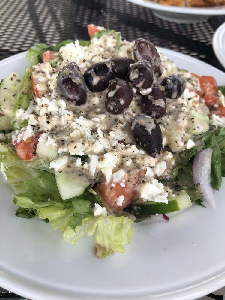 Greek Salad · Romaine, tomato, purple onion, pepperoncini, cucumber, Kalamata olives, feta and our own Greek dressing.