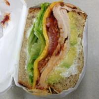 Chipotle Dagwood Sandwich · Turkey, bacon, avocado, chipotle mayo, lettuce, tomato, onion and cheddar on toasted multigr...