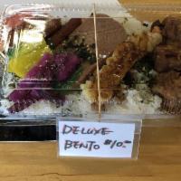 Deluxe Bento · 1 spam, 3 mini arabiki, 3 karaage, 1 shrimp tempura and tsukemono.