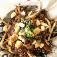 Classic Poutine · Start with a base of our hand cut crispy fries, add Wisconsin's finest Ellsworth white chedd...
