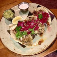 Carnitas · Slow roasted heritage pork, green Chile salsa, pickled red onion. Gluten free. Classic: on h...