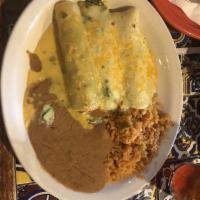 Spinach Enchiladas · 2 flour tortillas stuffed with our special spinach recipe, topped with cilantro cream sauce ...