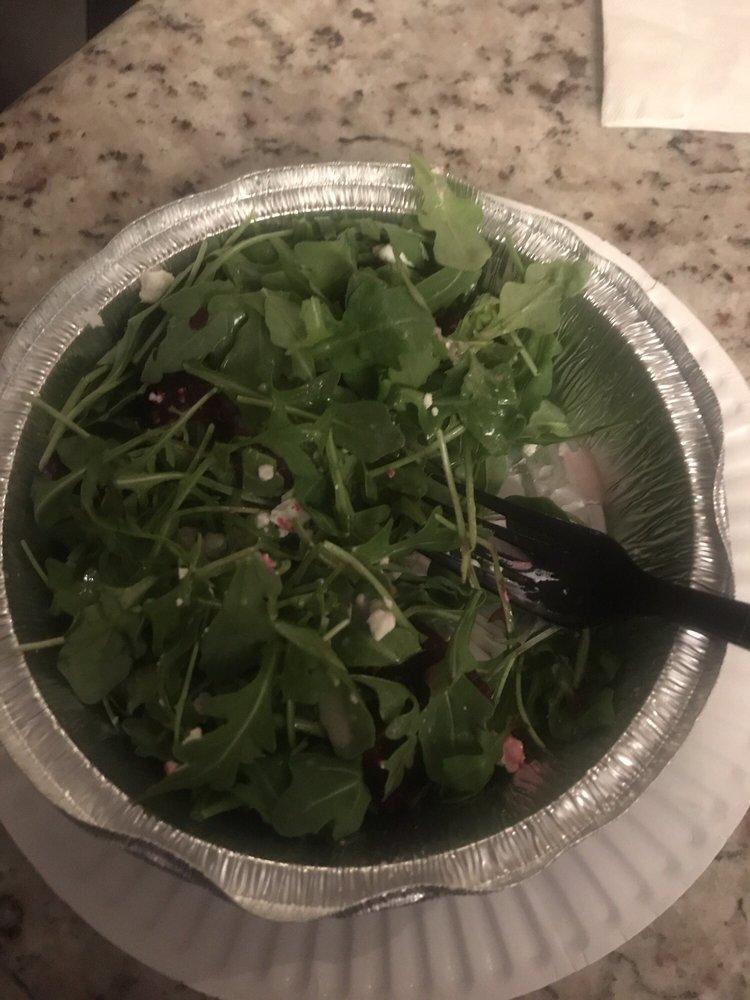Arugula Salad · Arugula, red onions, fresh mushrooms, and cherry tomatoes tossed in our homemade creamy balsamic dressing.