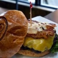 Da Wink Burger · 5oz Beef, American cheese, apple wood bacon, lettuce, tomatoes and emoji aioli. Cooked mediu...