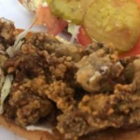 Oyster Po-boy · Dressed with lettuce, pickles, tomstoes, and, mayo