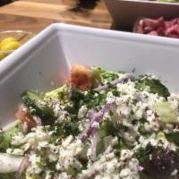 Greek Salad · Lettuce, tomatoes, onions, cucumbers, parsley, sumag, Greek feta cheese and Kalamata olives....