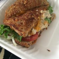 Captain Ed's Tuna Melt · Albacore salad on Dave's killer bread grilled with sharp cheddar melted all over the place w...