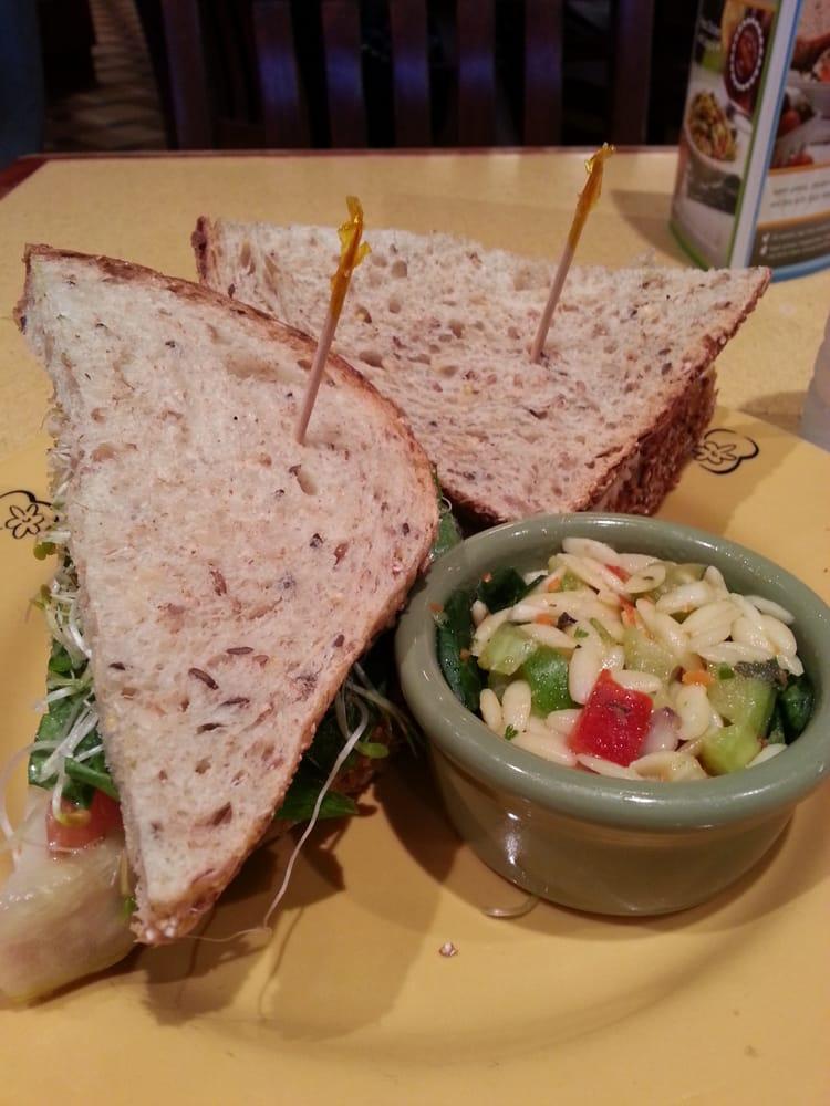 Almond Tuna Sandwich · albacore tuna, smokehouse almonds, apple, celery, scallions & mayo with dill pickles, lettuce, tomatoes, pea shoots, grain mustard on nine grain & served with a side