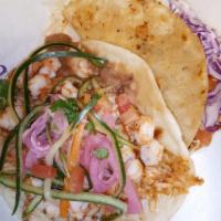 Gobernador Taco · Chopped shrimp sautéed with pico de gallo, mozzarella cheese, cabbage, & chipotle and aioli ...