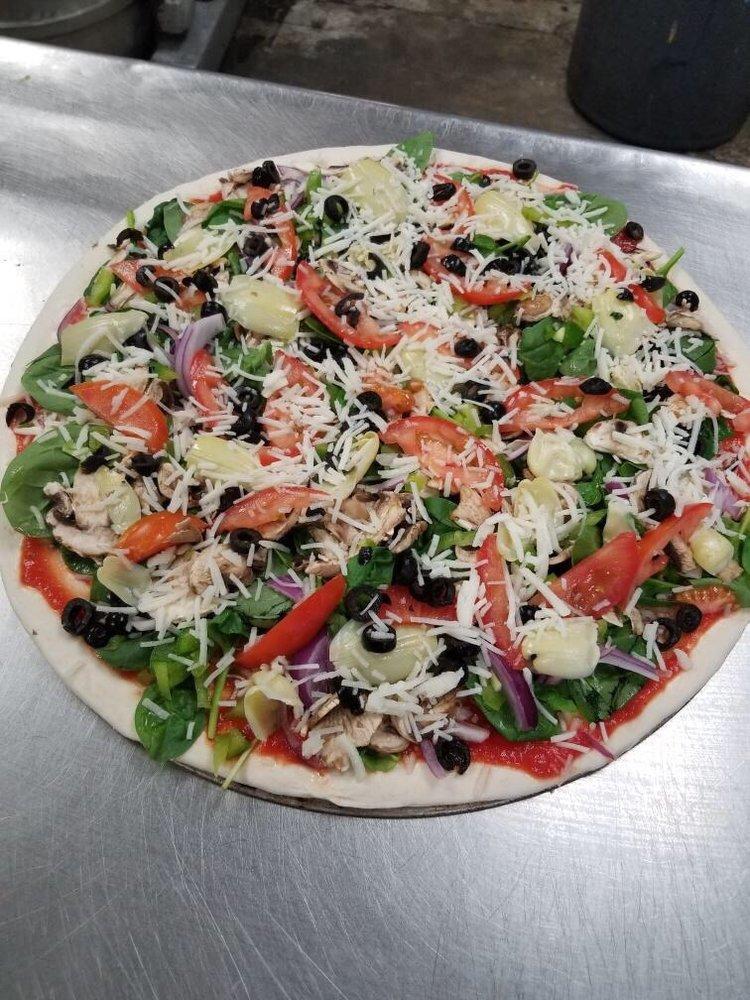 Vegetarian Pizza · Fresh tomatoes, artichokes, olives, spinach, onions, mushrooms and bell pepper.