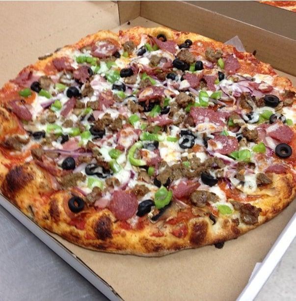 New York Works Pizza · Pepperoni, Canadian bacon, Italian sausage, onions, mushrooms, green peppers, black olives, salami and mozzarella cheese.