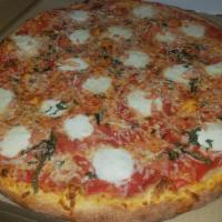 Margherita Pizza · Fresh tomatoes, fresh basil, fresh garlic and fresh mozzarella.
