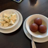 Gulab Jamun · Sweet balls, juicy deep fried pastry with honey syrup and rosewater.