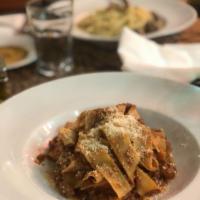 Pappardelle · Bolognese sauce and Parmigiano cheese.