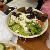 Greek Salad · Romaine Lettuce , Tomato , cucumber , Feta Cheese , Greek Olives and House Dressing 