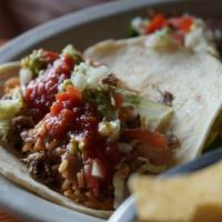Brisket Taco · Your choice of corn or flour tortillas filled with brisket, served with pico de gallo and gu...