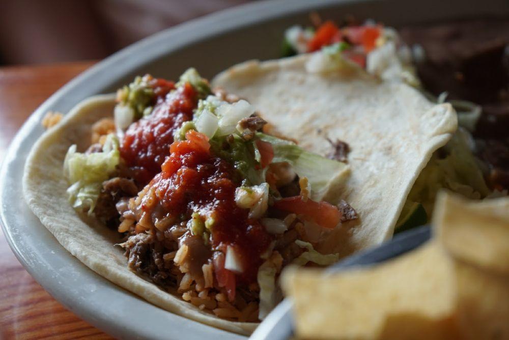 Brisket Taco · Your choice of corn or flour tortillas filled with brisket, served with pico de gallo and guacamole.