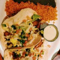 Fish Tacos · 2 corn or flour tortillas, filled with pan seared tilapia and topped with lettuce, tomato, c...