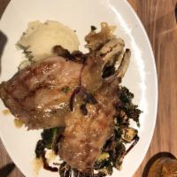 Maple Glazed Double Pork Chop · Garlic thyme mashed potatoes, grilled onions & Brussel sprouts. Butterfly cut if ordered med...