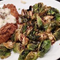 Rosemary Brined Buttermilk Fried Jidori Chicken · Garlic thyme mashed potatoes, Brussel sprouts & country gravy.