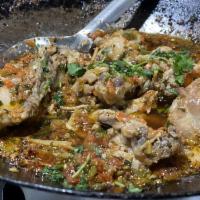 Chicken Karahi · Bone-in chicken pieces cooked in traditional Pakistani wok with freshly grounded spices, tom...