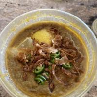 Haleem · Lentils and shredded beef slowly cooked and garnished with lemon, ginger, and fried onion.  