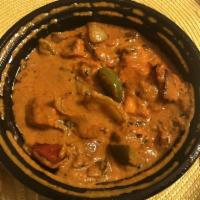 Chicken Tikka Masala · Boneless chicken cooked in a savory tomato sauce with peppers and onions. Gluten free.