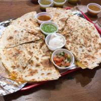 Steak Quesadilla · Your choice of 4 or 8 slices grilled to perfection. Served with pico de gallo, sour cream, a...