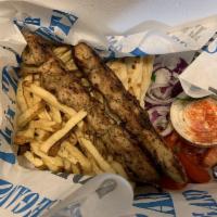 Chicken Souvlaki Plate · Fresh cut chicken, skewered and seasoned with Greek spices, cooked over open flame.