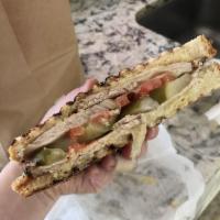 Crazy Russian Panini · Roasted pork, cheese, onions, pickles, tomatoes, mustard and horseradish.
