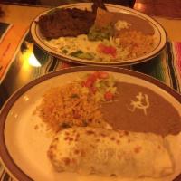 Carne Asada · 8 oz Flank steak, grill with cheese enchilada, guacamole, rice and beans.