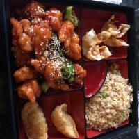 Sesame Chicken · Battered chicken glazed in our tangy honey brown sauce. Prepared with white meat chicken and...