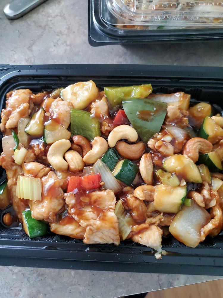 Cashew Chicken · White meat chicken sauteed with zucchini, onion, bell pepper and celery mushroom in a mildly sweet and savory sauce topped with cashews. Served with jasmine rice.