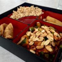 Kung Pao Chicken · White meat chicken stir fried with mixed vegetables in a spicy savory sauce topped with salt...