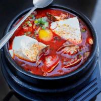 Ramyun Soon Tofu · Korean noodles with vegetables, silken tofu and dropped egg. Hot and spicy.