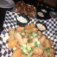 Veggie Wings · Buttermilk-marinated cauliflower, breaded, fried, and tossed in your choice of wing sauce. C...