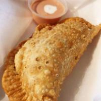 Empanada · Fried pastry filled with cheese and your choice of ground beef, shredded chicken, chorizo, b...