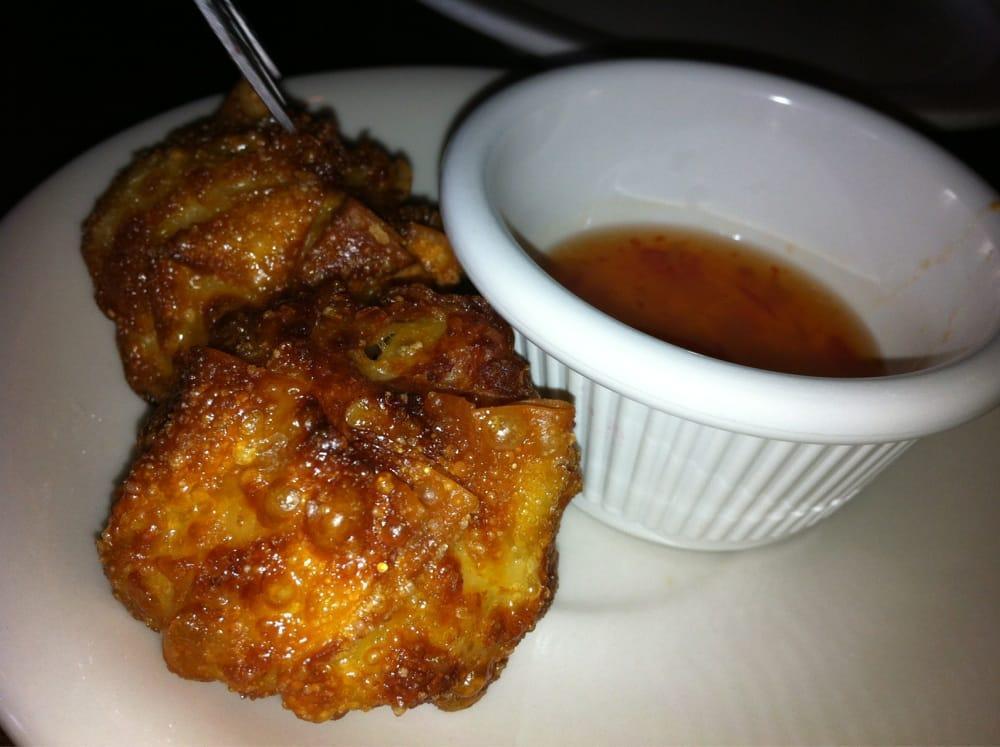 Golden Fritters · Fried minced chicken in wonton wrappers served with sweet chili sauce.