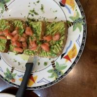 Avocado Toast · Mashed avocado on multi-grain toast, sprinkled with pink Himalayan salt and garnished with f...
