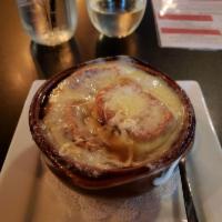French Onion Soup · House-made topped with Swiss cheese.