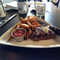 Steak Frites · Grilled steak topped with red wine and herb compound butter served with house cut fries and ...