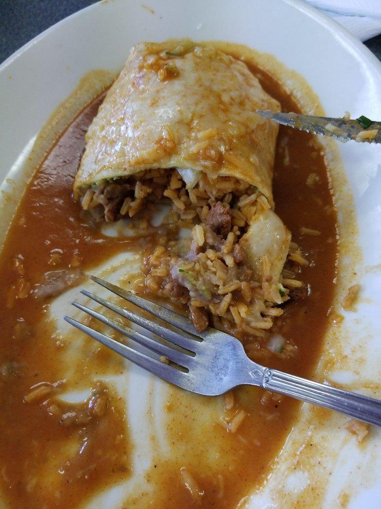 Wet Burrito · Filled with rice, beans, salsa, guacamole, cheese and sour cream. Then its topped with burrito salsa, pico de gallo and a sprinkling of cheese. Burritos are made with flour tortillas.
