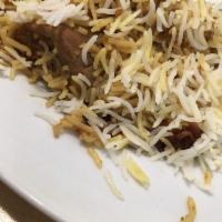 Chicken Biryani · Pieces of chicken and long grain rice cooked in a sealed pot with exotic Pakistani spices.