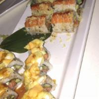 King Salmon Sushi Room Favorite · Minced salmon, avocado, masago and scallion inside out roll topped with salmon, truffle oil,...
