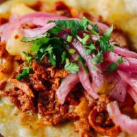 Pastor Pork Taco · Grilled marinated pork, grilled pineapple, pickled red onions, fresh cilantro and toasted ch...