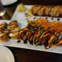 Las Vegas Roll · Deep fried salmon tempura, cream cheese, crab salad, avocado, eel sauce, and spicy mayo