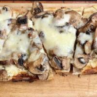 Cremini Mushroom Flatbread · Herb goat cheese, rosemary, thyme, garlic and truffle oil.