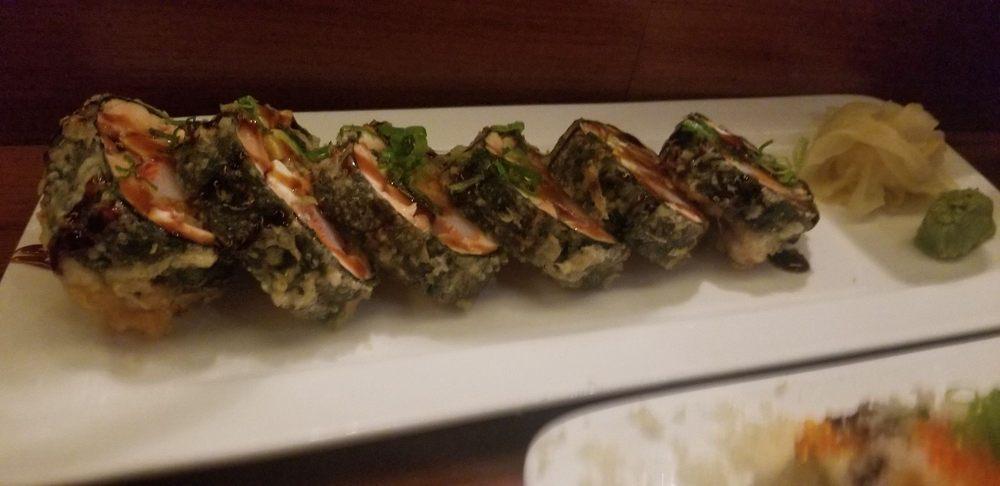 Genki Ya Roll · Tuna, salmon, crab stick, avocado, sweet potato tempura, cream cheese, and flying fish roe. Deep-fried with tempura batter.
